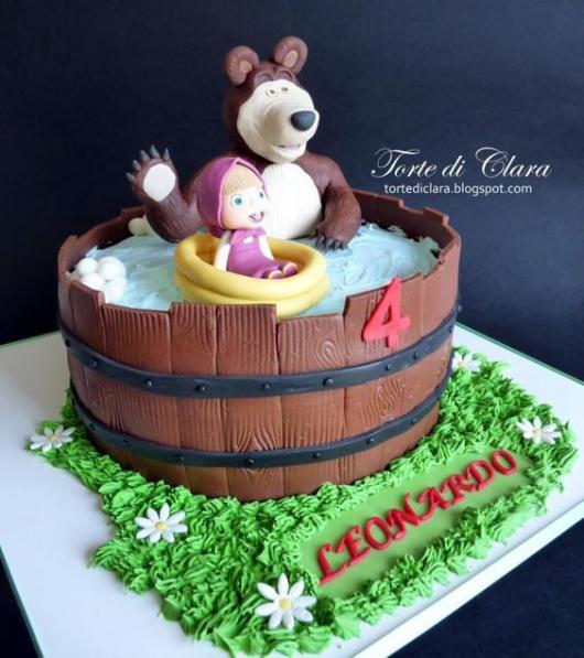 Cake made like a kind of bathtub, with Masha and the Bear inside.