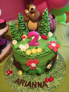 Masha and Bear cake with flowers and trees.
