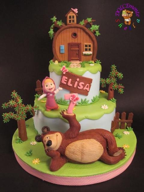 Three-tier cake, with the Bear in the first, Masha in the middle and the Bear's house on top.