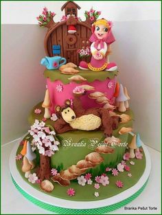 Three-tiered cake, with Bear lying down and Masha on top.
