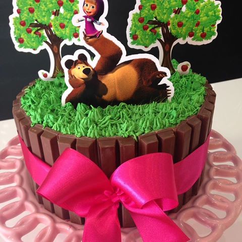 Kit kat cake, with whipped cream topping and Masha and the Bear decorations.