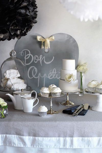 Table decorated with white, gray and silver items.