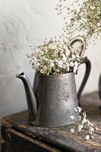 Teapot serving as a vase.