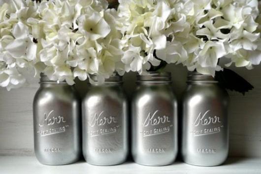 Gray vases with white flowers.