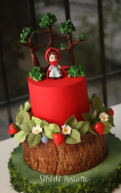 little red hat cake with a floor with tree trunk texture.