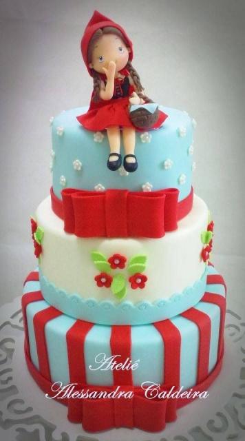 three-tier red hat cake in blue and red