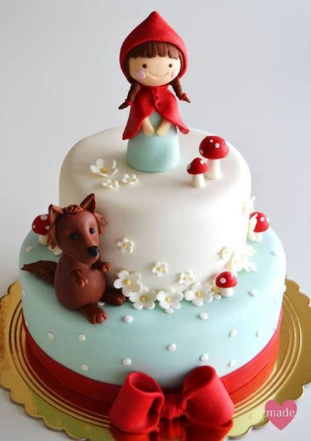 two-layer red hat cake with the little hat and the wolf in each layer