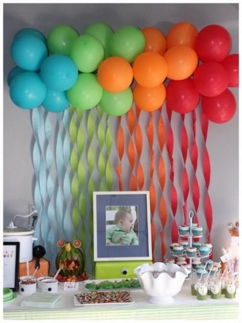 Decoration with blue, green, orange and red balloons.