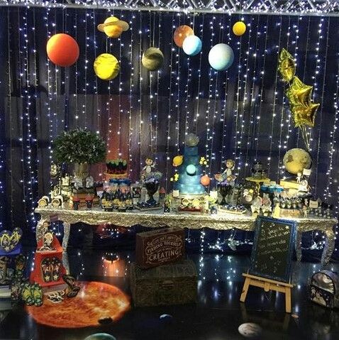 Decoration with dark blue table background, flashes blinks and solar system planets.