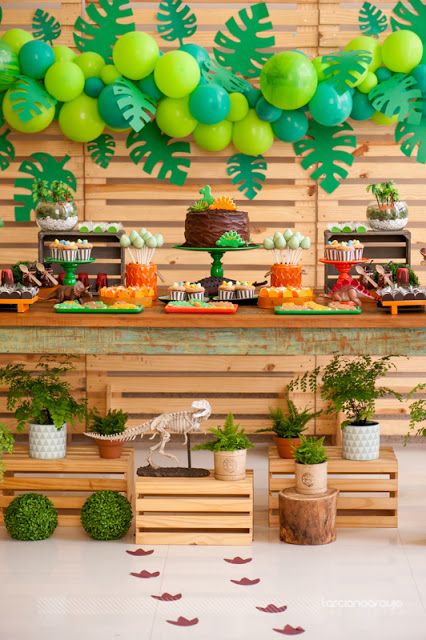 Party decoration with fair crates, pallets, balloons and plants.