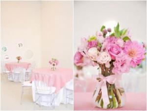 Decorated with tables with pink tablecloths and a centerpiece with flower arrangements