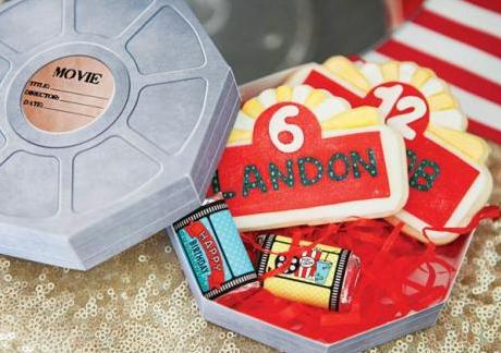 Surprise box for birthday party favors in film reel box format