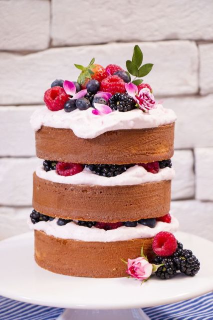 Cake Decorated with Fruits with lots of whipped cream