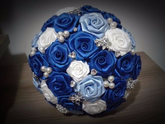 Satin bouquet with pearls and blue flowers