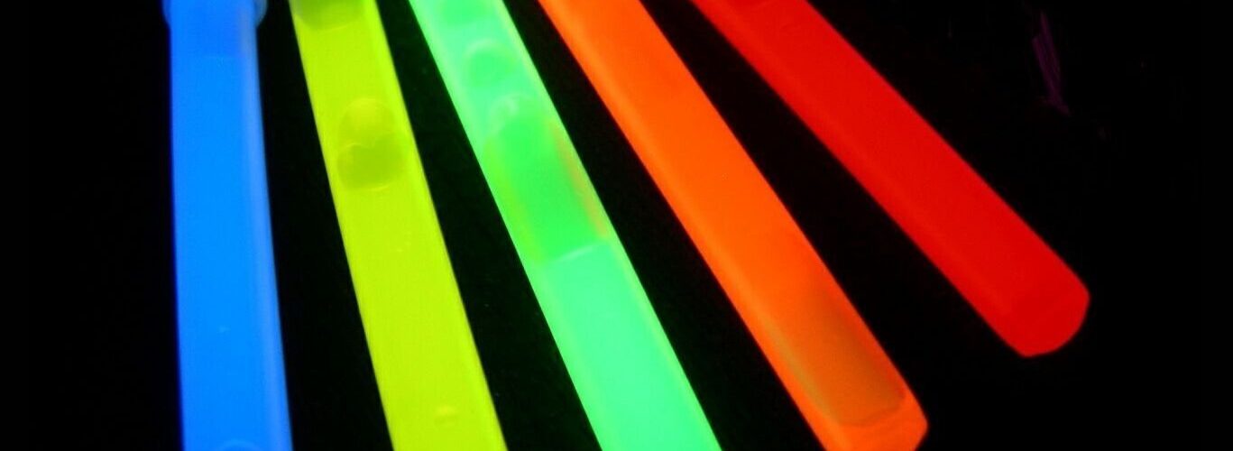 How do you get glow sticks to stick to clothes?