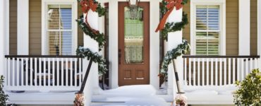 How do you secure a garland around your front door?