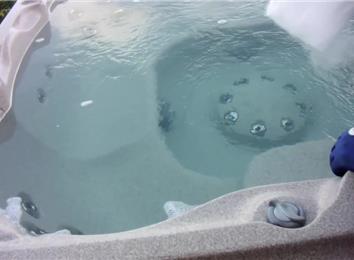 Is it OK to put dry ice in a hot tub?