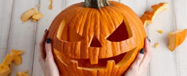 Is it better to carve pumpkin from top or bottom?