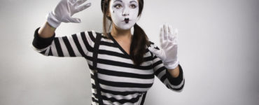 Why are mimes faces white?